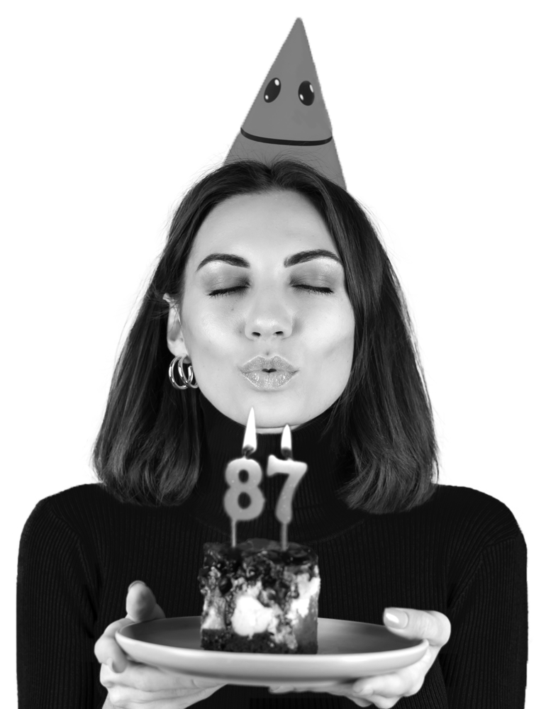 Woman blowing out candles